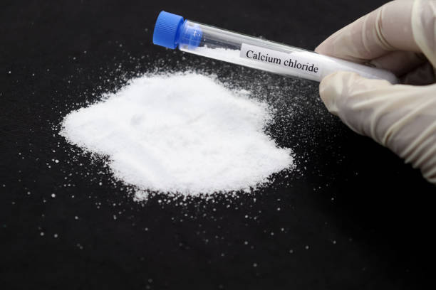 istockphoto-1353006202-612x612 - Calcium chloride in test tube and black background